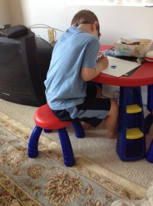 Jacob after his first day of camp . . . wearing some other kid's shorts