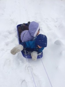 Me and Jacob sledding.  Down the sidewalk.  